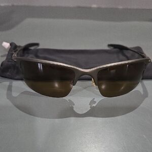 Oakley Sunglasses with Amber Polarized Lenses and Metallic Frame